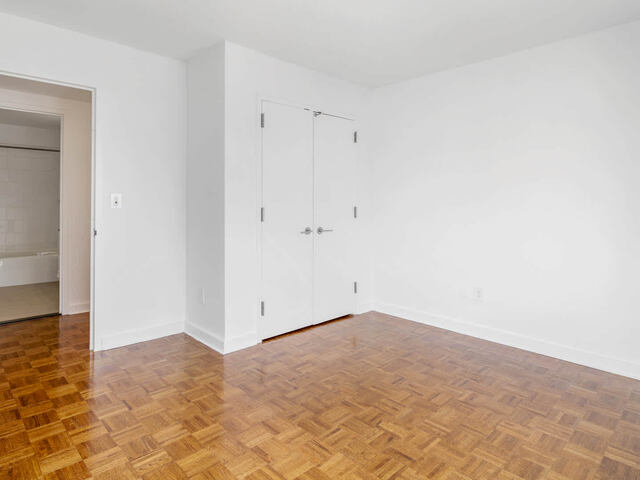 Bedroom with Wood Parquet Flooring