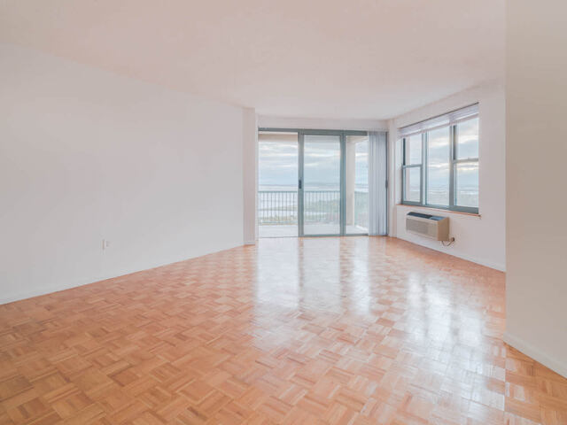 Living Room with Balcony and Parquet Flooring