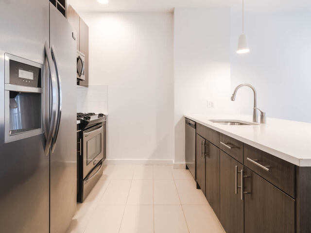 Kitchen with Quartz Countertops and Stainless Steel Appliances