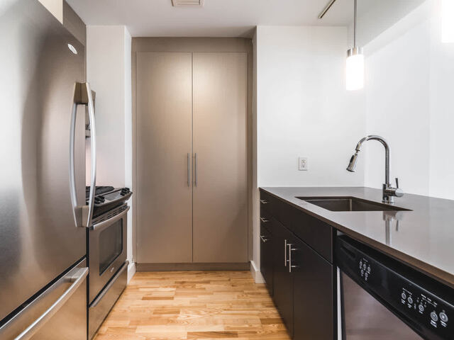 Kitchen with Quartz Countertops and Stainless Steel Appliances
