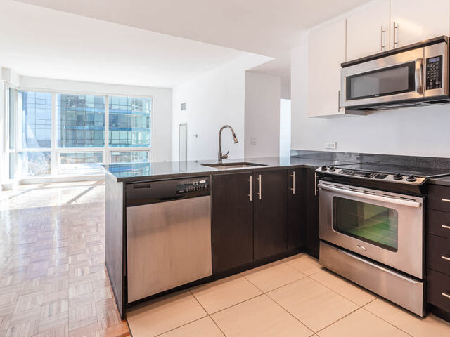 Living Room and Kitchen with Stainless Steel Appliances