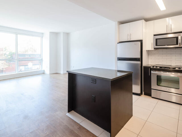 Living Room and Kitchen with Stainless Steel Appliances
