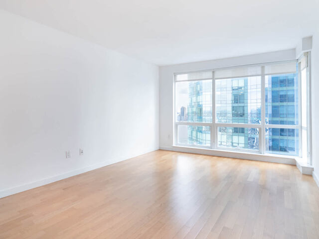 Living Room with Hard Surface Flooring and Floor to Ceiling Windows