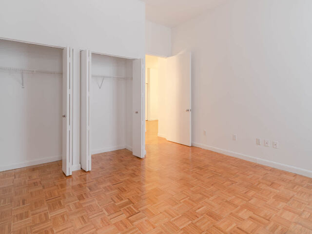 Bedroom with Parquet Wood Flooring