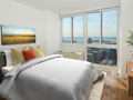 Bedroom with Wood Parquet Flooring and Views of the City