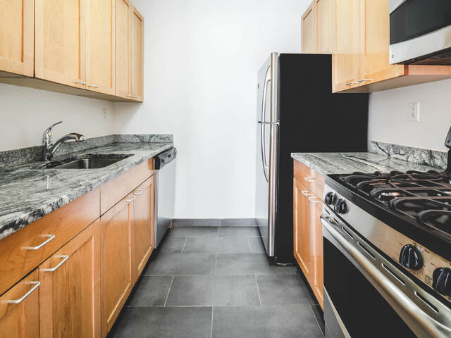 Kitchen with Granite Countertops and Stainless Steel Appliances