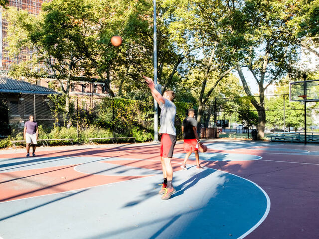 Nearby park spaces and sports courts.