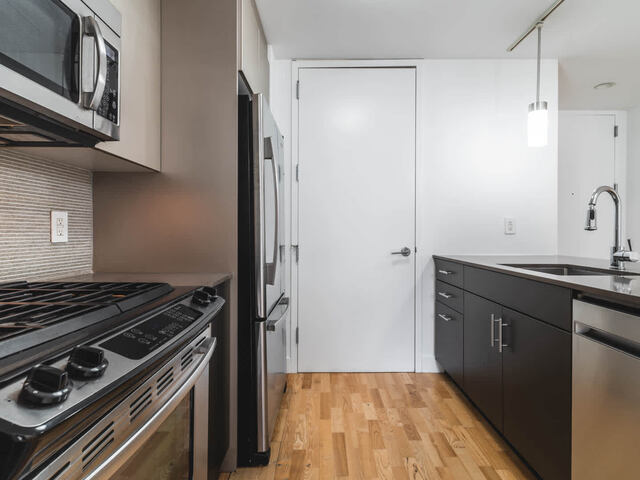 Kitchen with Quartz Countertops and Stainless Steel Appliances