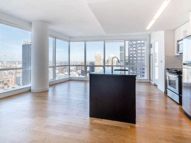 Kitchen and Living Room with Floor to Ceiling Windows