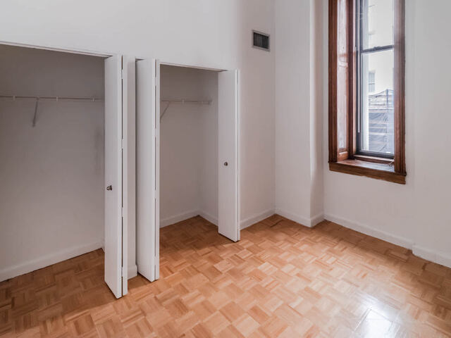 Bedroom with Parquet Wood Flooring