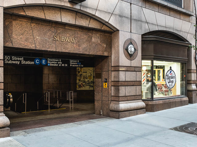 Across the street from the 50 Street Subway.