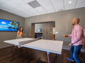 Challenge a friend to a Table Tennis match in the Game Room